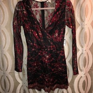 Lacy black/red/gold long sleeve romper